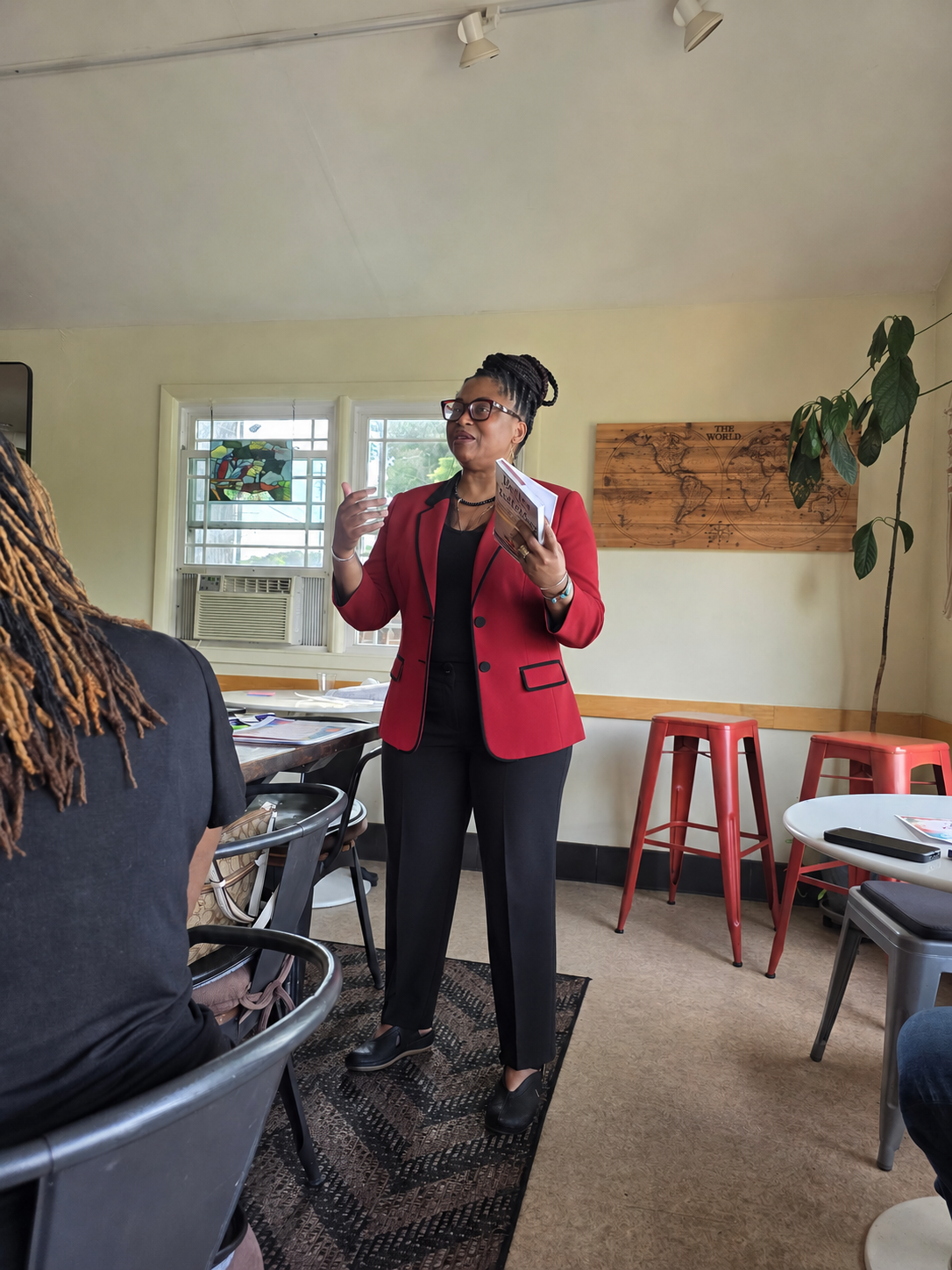 Hermence speaking during a Better Than Yesterday event