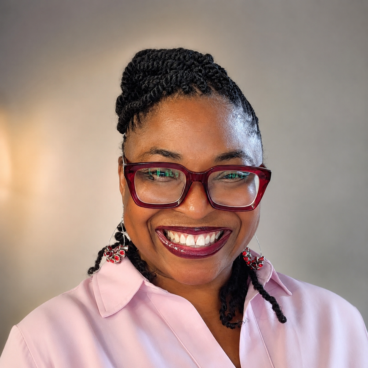 Hermence Matsotsa smiling in a pink blouse